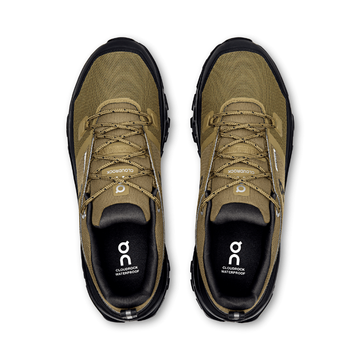 "On Running Cloudrock Low Waterproof Hunter Black hiking shoes by Hype Elixir – durable, weatherproof, and high-performance outdoor footwear."