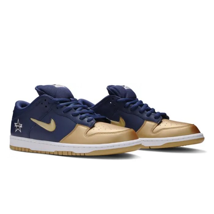 Stylish Nike SB Dunk Low Supreme with a gold jewel swoosh, combining classic Dunk design with luxurious details. Perfect for collectors. Available now at HypeElixir.com