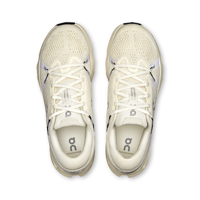 "On Running Cloudsurfer 2 Ivory sneakers by Hype Elixir – lightweight, cushioned running shoes with a sleek ivory colorway for optimal comfort and performance."