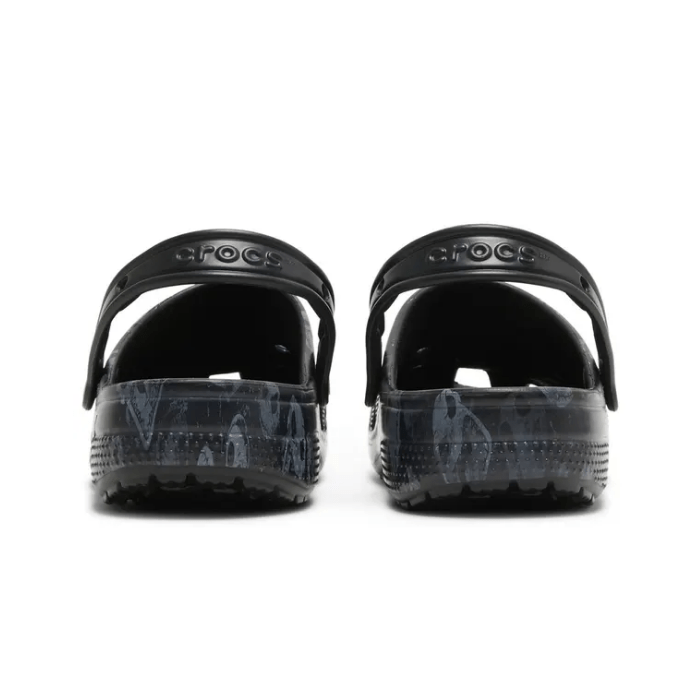 "Crocs Classic Clog Nightmare Before Christmas by Hype Elixir – iconic, spooky clogs featuring characters from the Nightmare Before Christmas, blending comfort with a Halloween-inspired design."