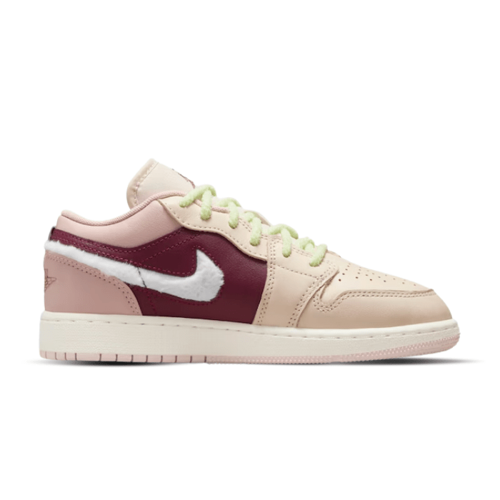 Jordan 1 Low SE Fur Swoosh (GS) features a cozy fur Swoosh and classic style in a playful design. Shop on hypeelixir.com.