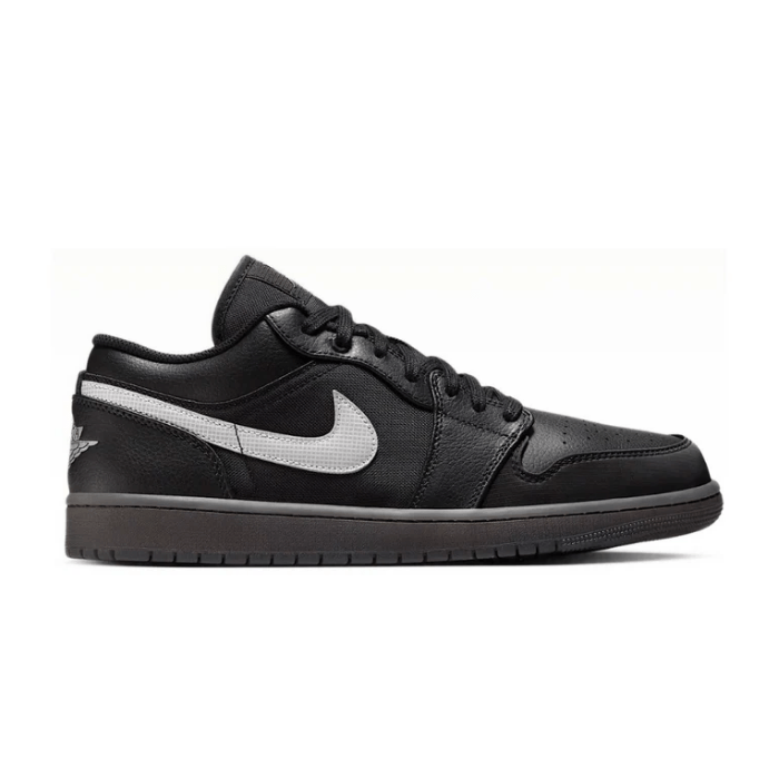 Jordan 1 Low in Black, White & Dark Smoke Grey offers a sleek design with timeless appeal. Shop now on hypeelixir.com.